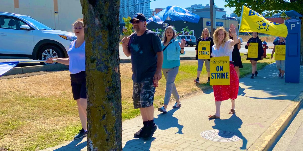 A photo of BCGEU members on the picket line.