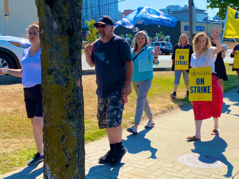 A photo of BCGEU members on the picket line.