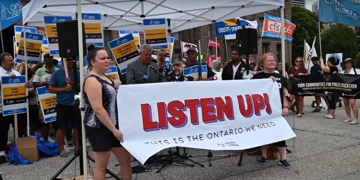 A screenshot of union members participating in the Listen Up protest outside of Queen's Park in Toronto on Monday, August 8, 2022.