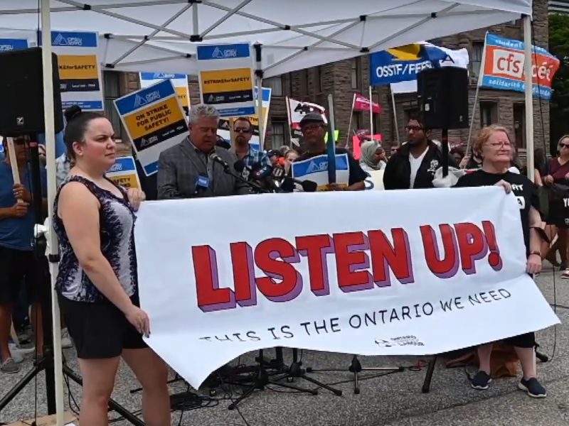 A screenshot of union members participating in the Listen Up protest outside of Queen's Park in Toronto on Monday, August 8, 2022.