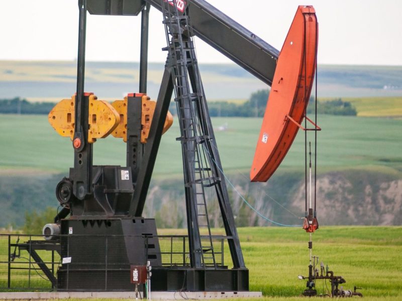 A photo of an oil pump jack in Alberta's Red River Valley.