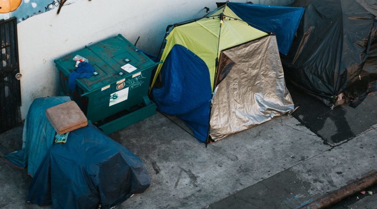 A photo of homeless encampments in a North American city.