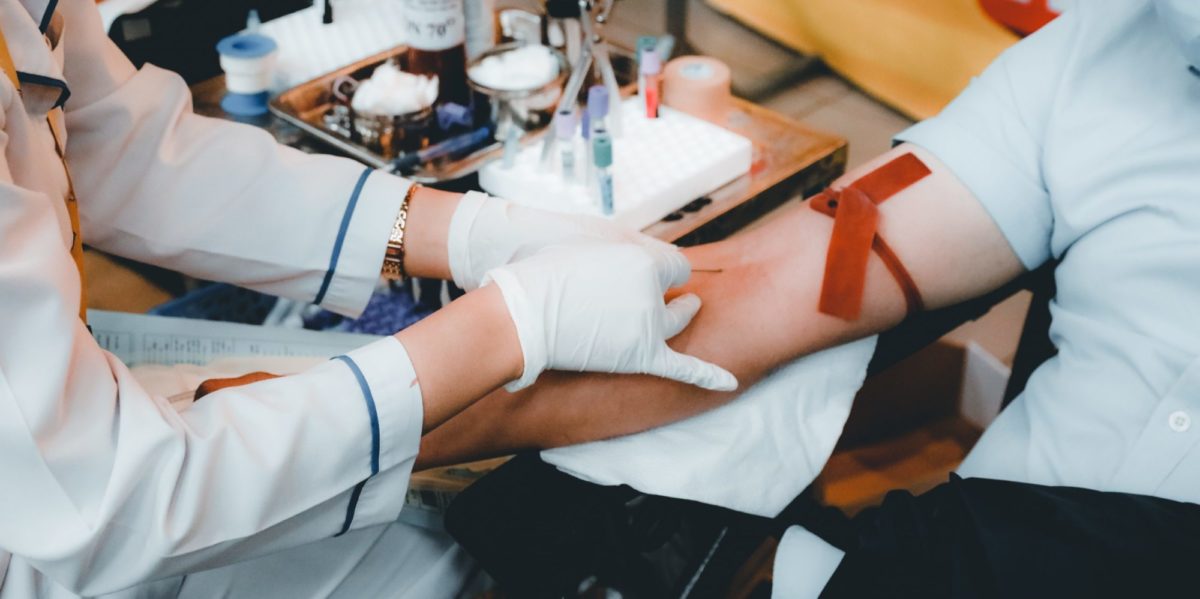 A photo of a person donating blood or plasma.