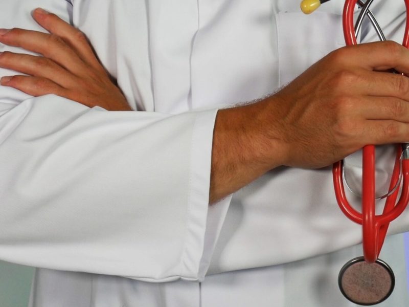 A photo of a doctor holding a stethoscope.