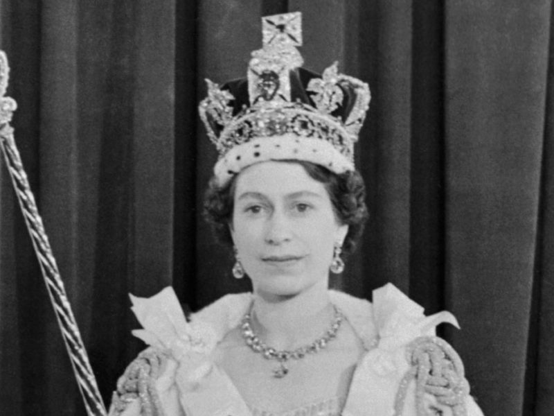 A photo of Queen Elizabeth II shortly after her coronation wearing the Imperial State Crown.