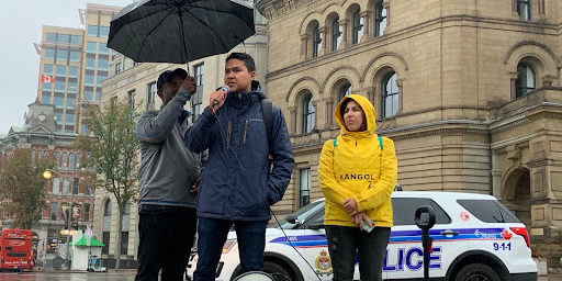 A photo of Emilio Rodriguez speaking at the Status for All rally in Ottawa September 18.