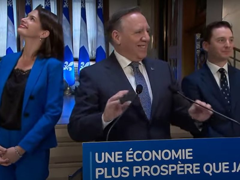 Francois Legault, pictured in the centre, announcing the end of the legislative session on June 10.