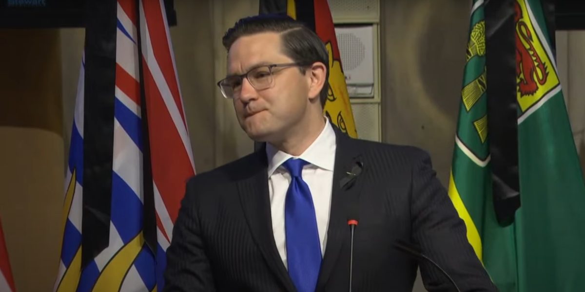 A photo of Pierre Poilievre during his first caucus address as leader.