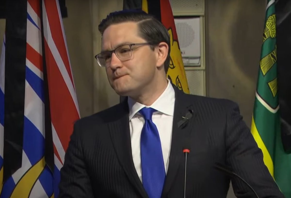 A photo of Pierre Poilievre during his first caucus address as leader.