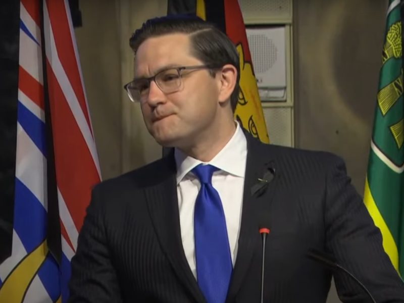A photo of Pierre Poilievre during his first caucus address as leader.