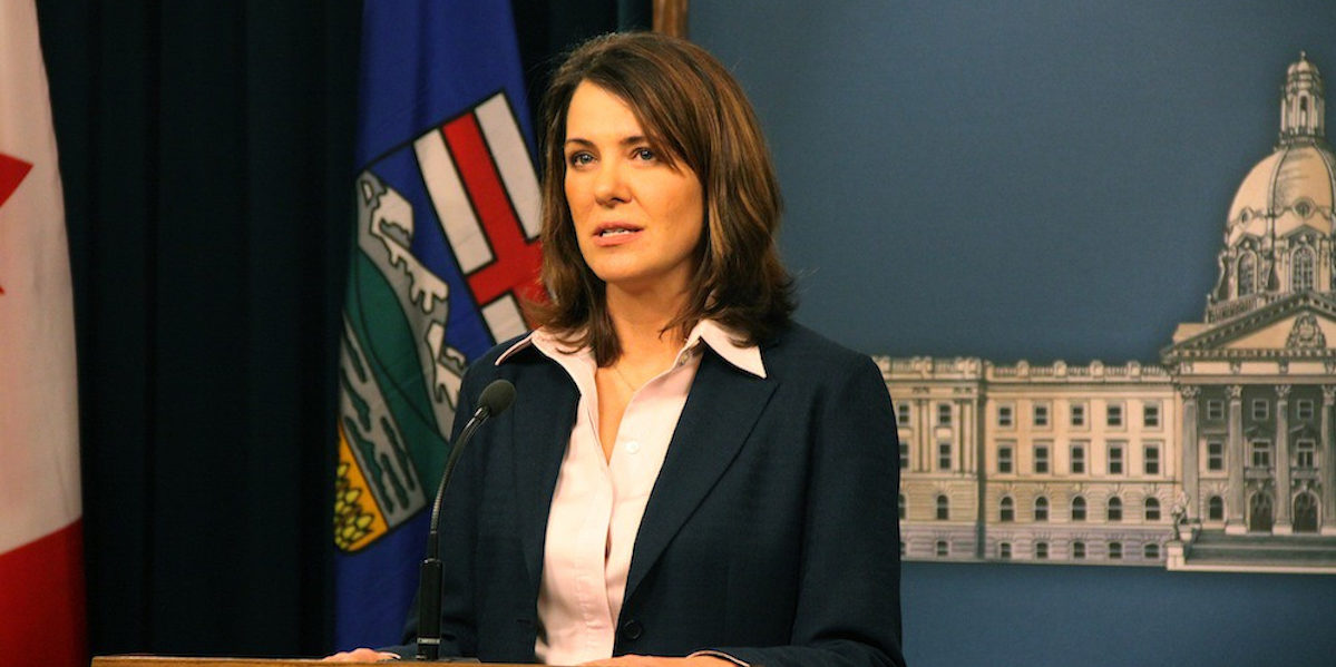 A photo of Danielle Smith in 2014, around the time she led many of her Wildrose Party MLAs across the floor to join the Progressive Conservative Party; disaster followed.