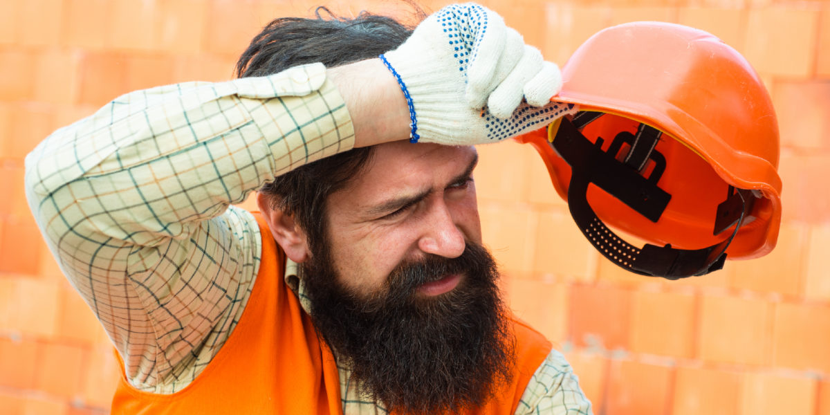 A photo of a construction worker out in the heat.