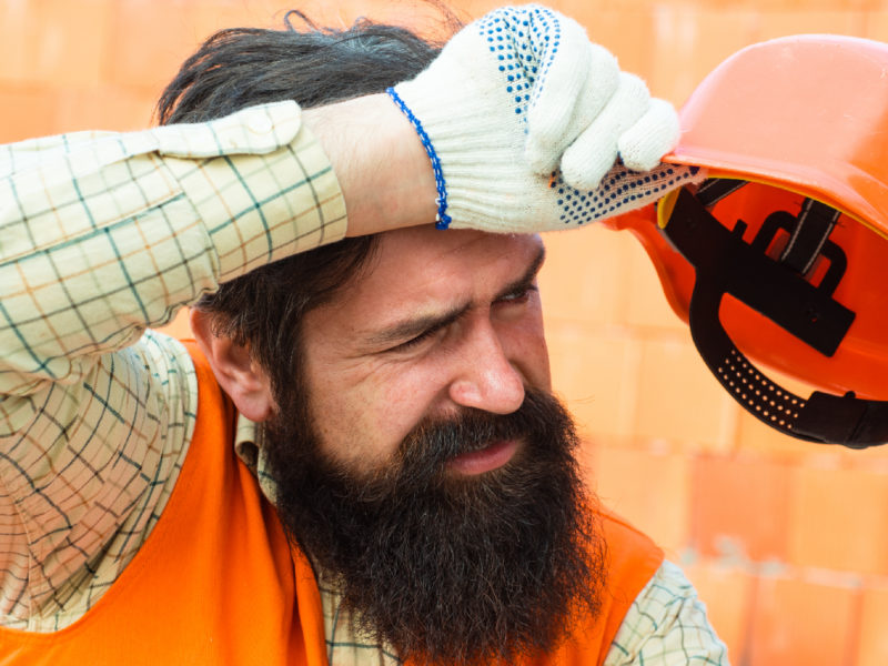 A photo of a construction worker out in the heat.