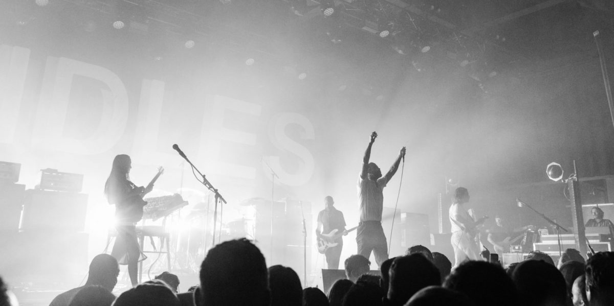 A photo of the band, IDLES, performing in Toronto.