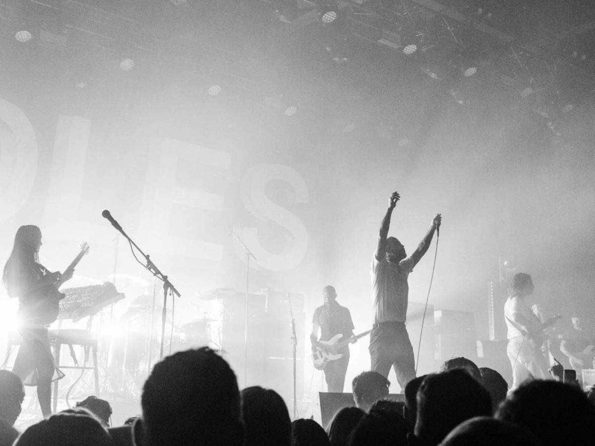 A photo of the band, IDLES, performing in Toronto.