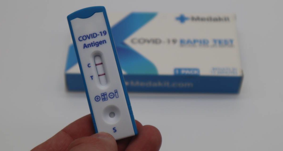 A photo of a positive COVID-19 rapid test.