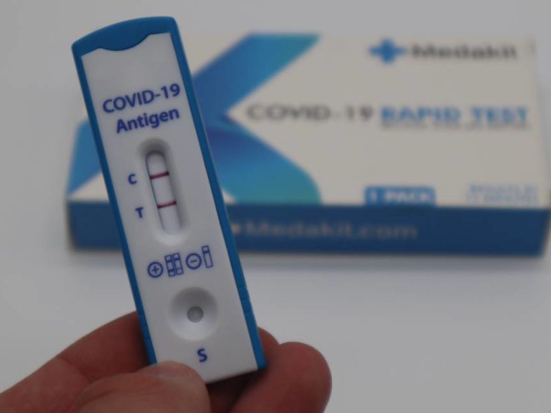 A photo of a positive COVID-19 rapid test.