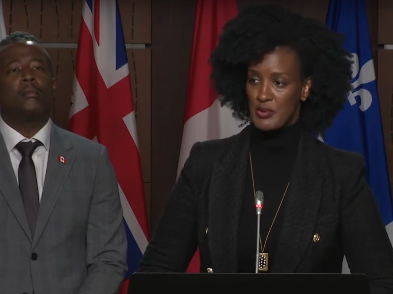 A screenshot of Amnesty International Canada Secretary General Ketty Nivyabandi as she addresses reporters during a press conference on October 2 along side BCAS executive director Nicholas Marcus Thompson.