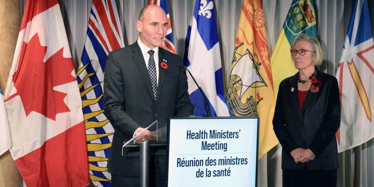 A photo of Canada's Health Minister Jean-Yves Duclos making a statement about healthcare funding alongside Minister for Addictions and Mental Health Carolyn Bennett.