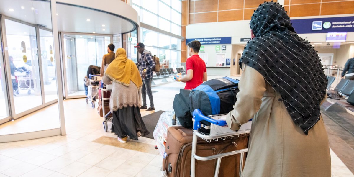 A photo of Afghan refugees arriving in Canada.