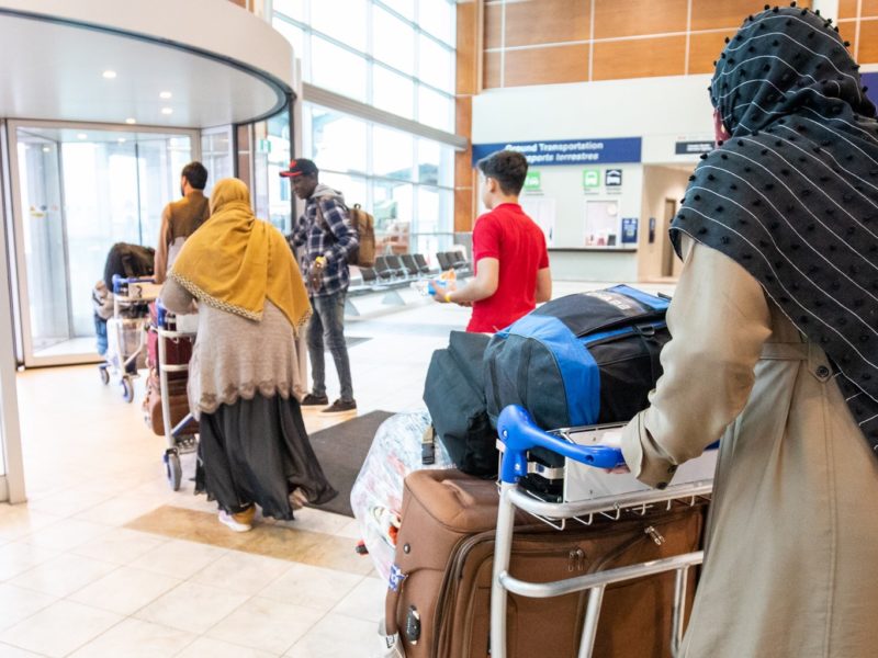 A photo of Afghan refugees arriving in Canada.