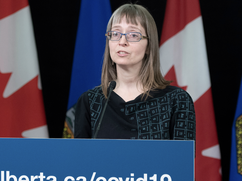 A photo of Dr. Deena Hinshaw, Alberta’s former chief medical officer of health, shown here in her famous periodic table of elements dress.