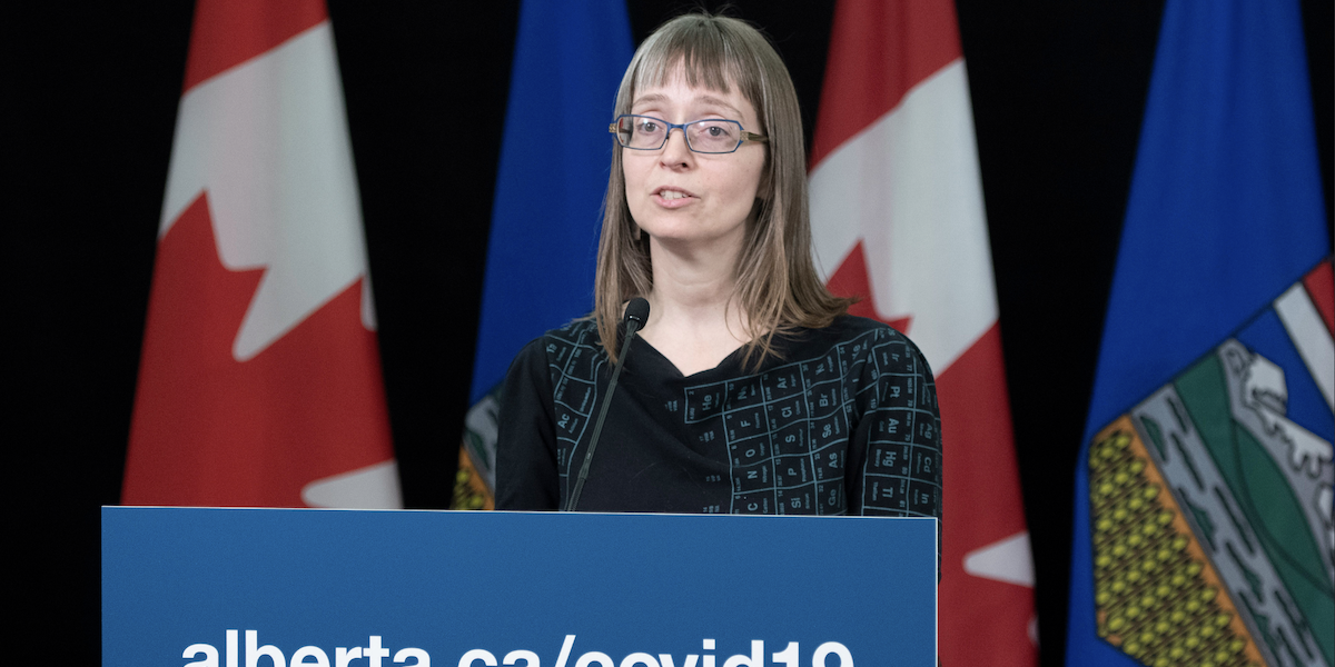 A photo of Dr. Deena Hinshaw, Alberta’s former chief medical officer of health, shown here in her famous periodic table of elements dress.