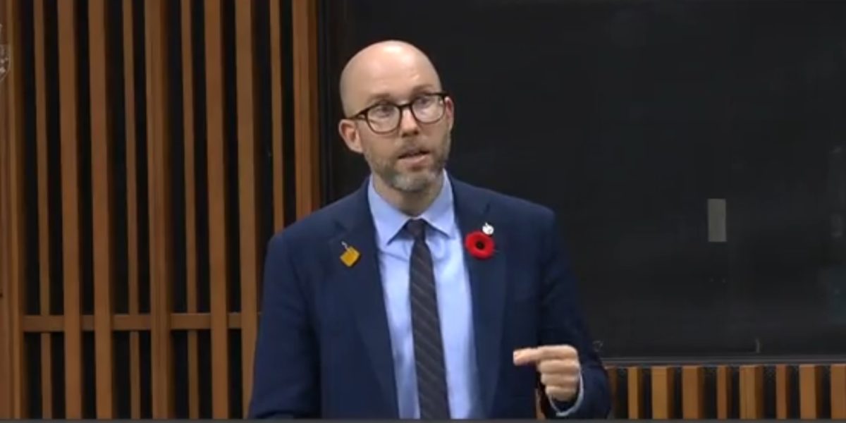 A photo of Green MP Mike Morrice speaking in the House of Commons abour REITs.