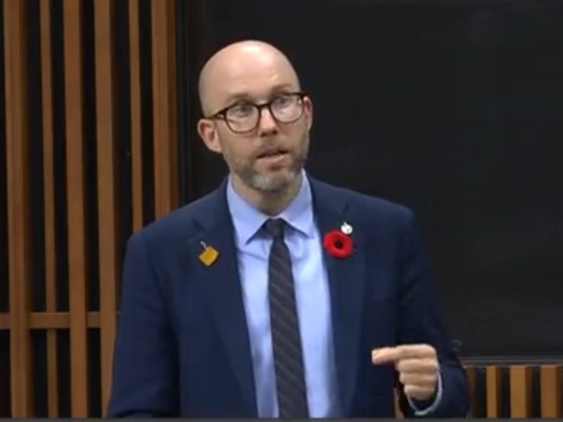 A photo of Green MP Mike Morrice speaking in the House of Commons abour REITs.