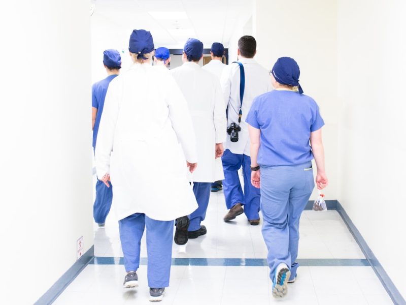 An image of a group healthcare workers walking down a hall