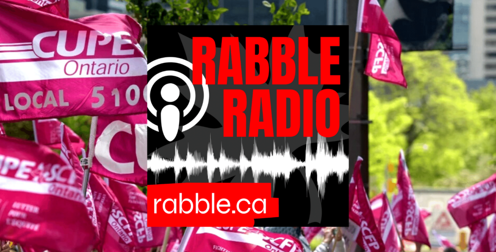 A photo of CUPE signs behind a rabble radio logo.