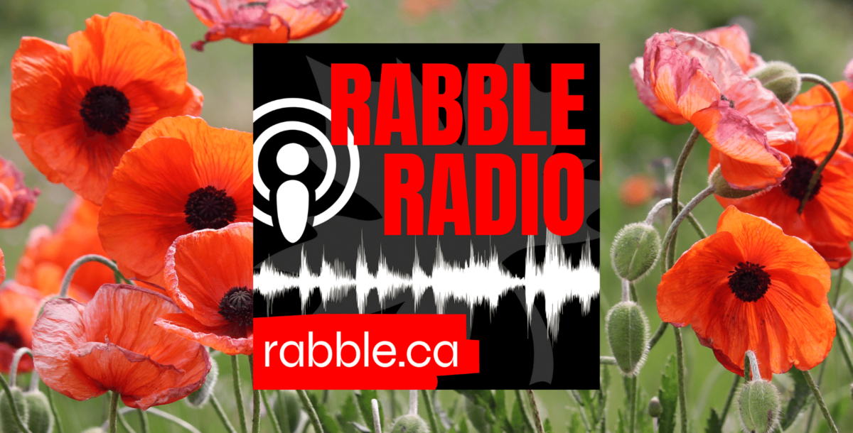 A promotional photo for rabble radio with the logo in the centre, and a field of poppies in the back.