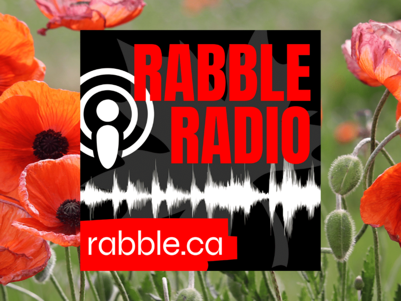 A promotional photo for rabble radio with the logo in the centre, and a field of poppies in the back.