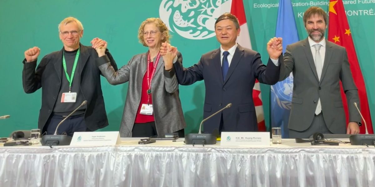 Canada's Environment Minister Steven Guilbeault celebrates with international partners at COP15.