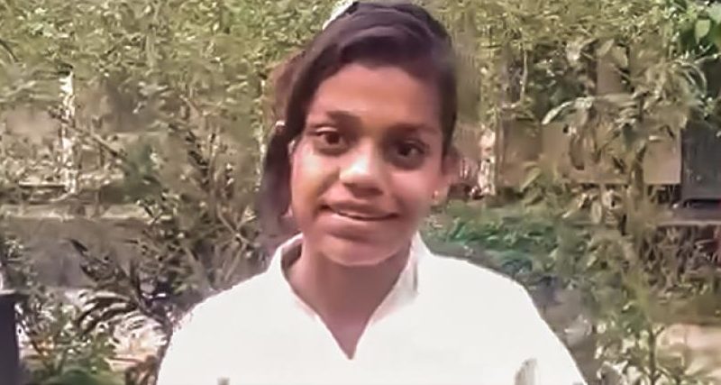 An image of Munira in her Karate uniform smiling at the camera.