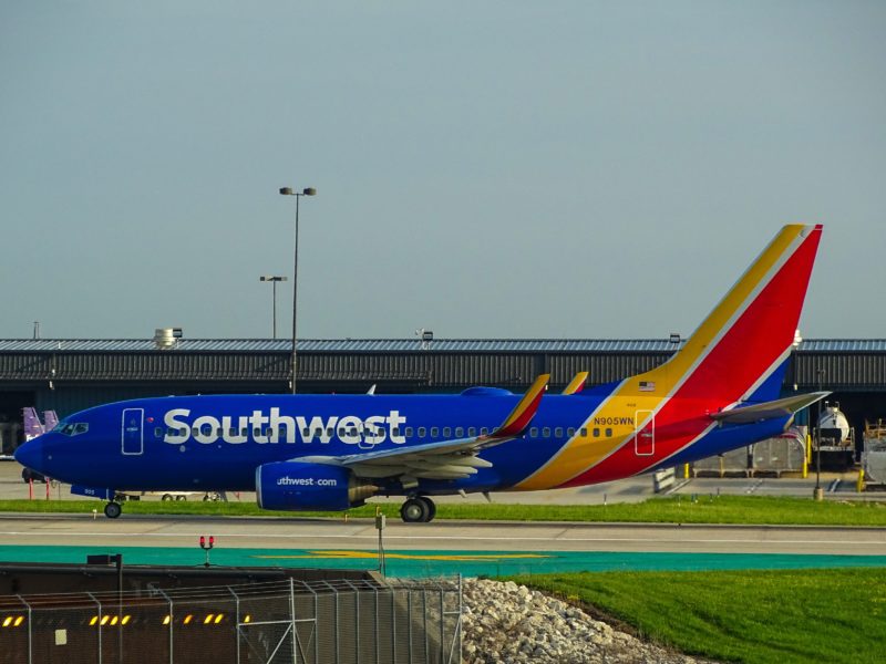 A plane chartered by Southwest Airlines sits on an airport tarmac.