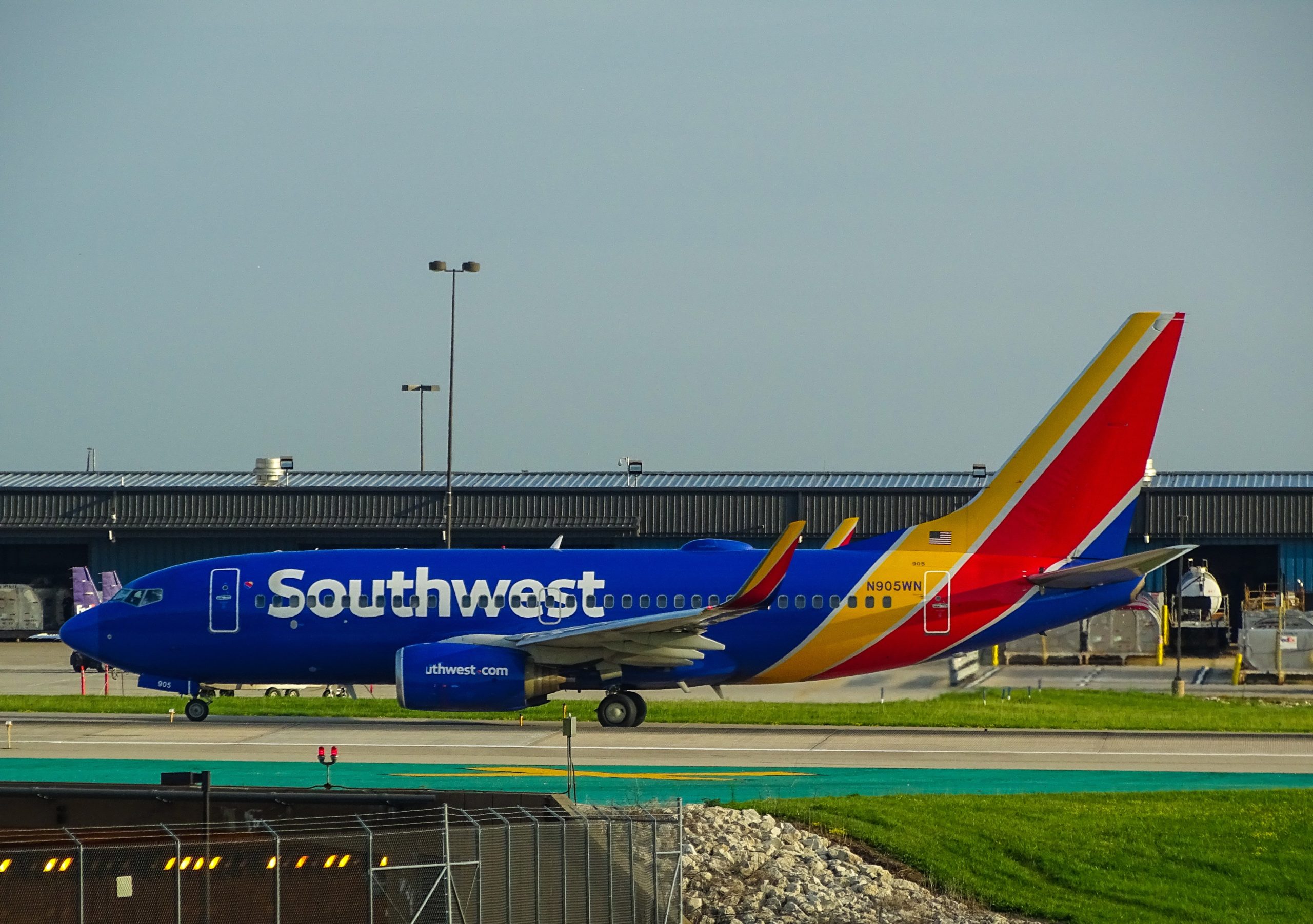 A plane chartered by Southwest Airlines sits on an airport tarmac.