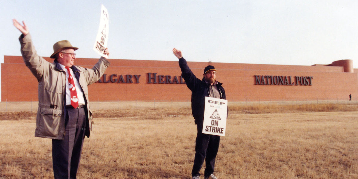 The author, at right, with the late and great Brock Ketcham on the picket line in front the Calgary Herald building around the brown Christmas of 1999..