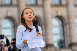 A photo of climate activist Greta Thunberg speaking to a crowd in Berlin.