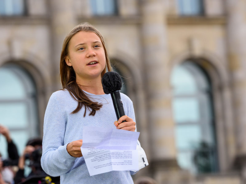 A photo of climate activist Greta Thunberg speaking to a crowd in Berlin.