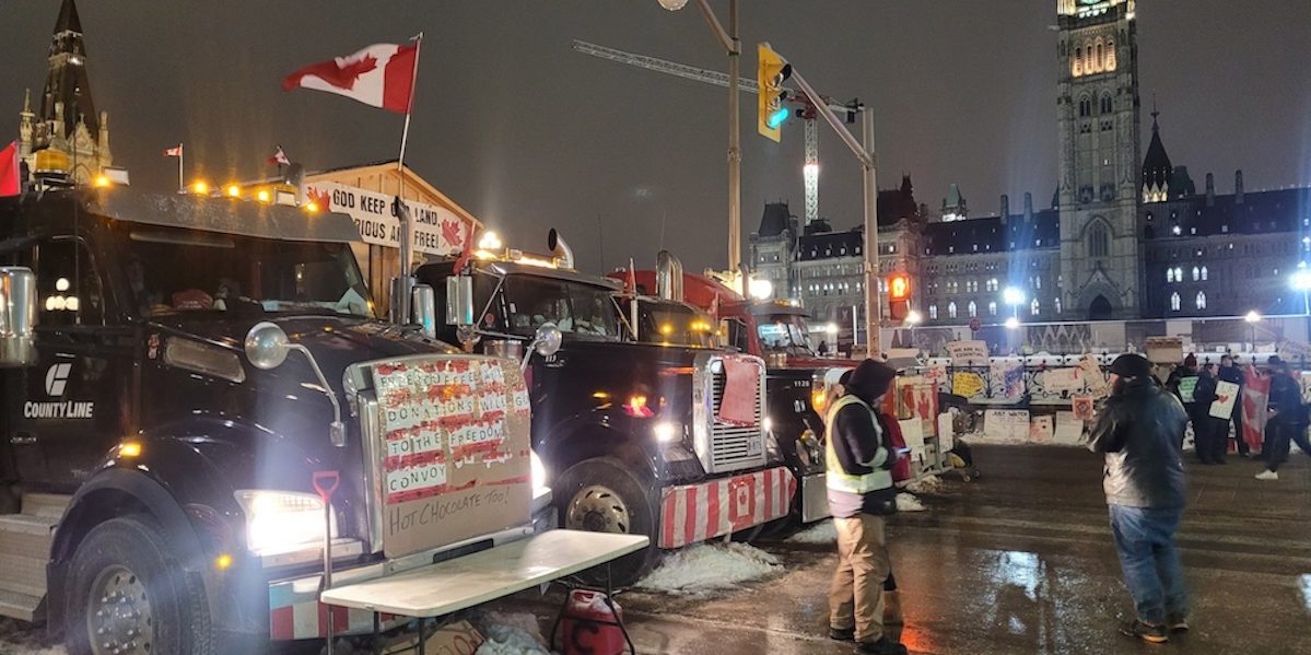 Trucks on Wellington Street in front of the Parliament Buildings in February 2022.