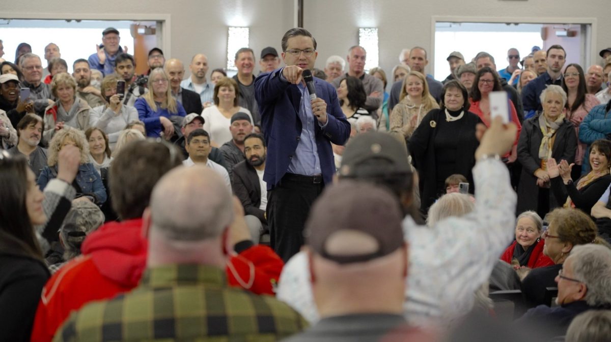 A photo of Conservative Leader Pierre Poilievre speaking to a crowd.