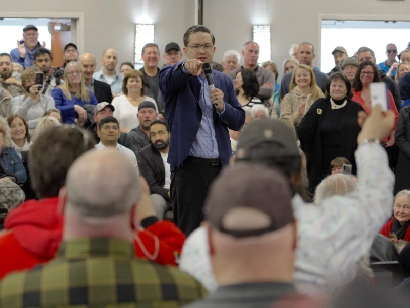 A photo of Conservative Leader Pierre Poilievre speaking to a crowd.