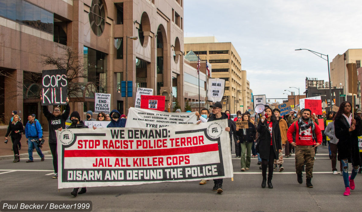 A photo of activists protesting the murder of Tyre Nichols and police violence rooted in anti-Black racism.