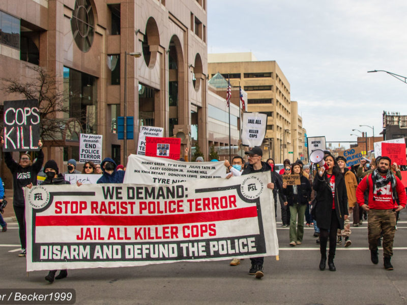 A photo of activists protesting the murder of Tyre Nichols and police violence rooted in anti-Black racism.