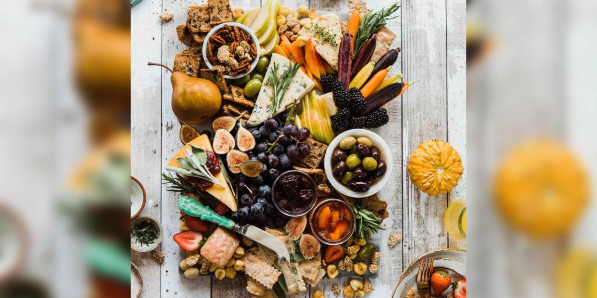 A farm table full of delicious foods.