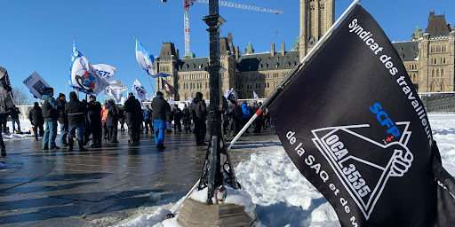 An SCPF flag on Parliament Hill during an anti-scab rally on January 31, 2023.