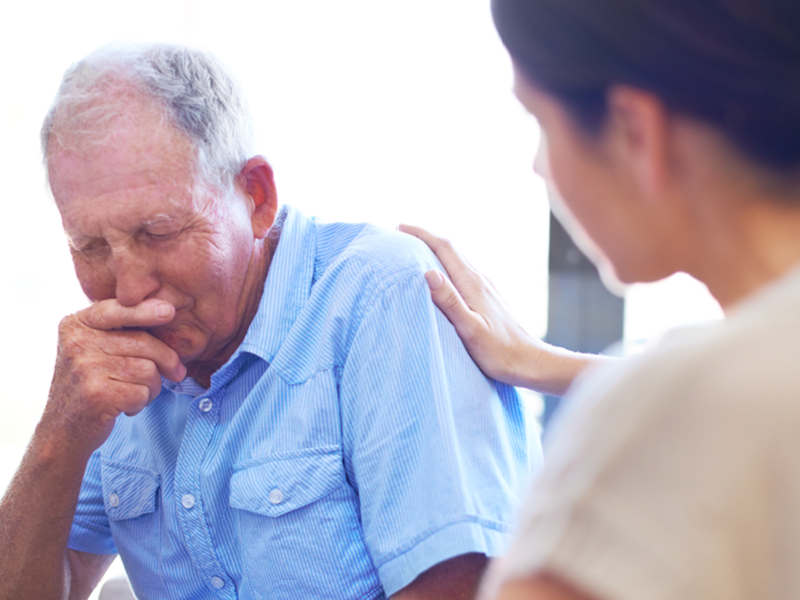 An image of an older gentleman sitting next to a younger woman.