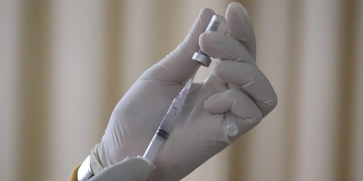 A vaccine being drawn into a needle.