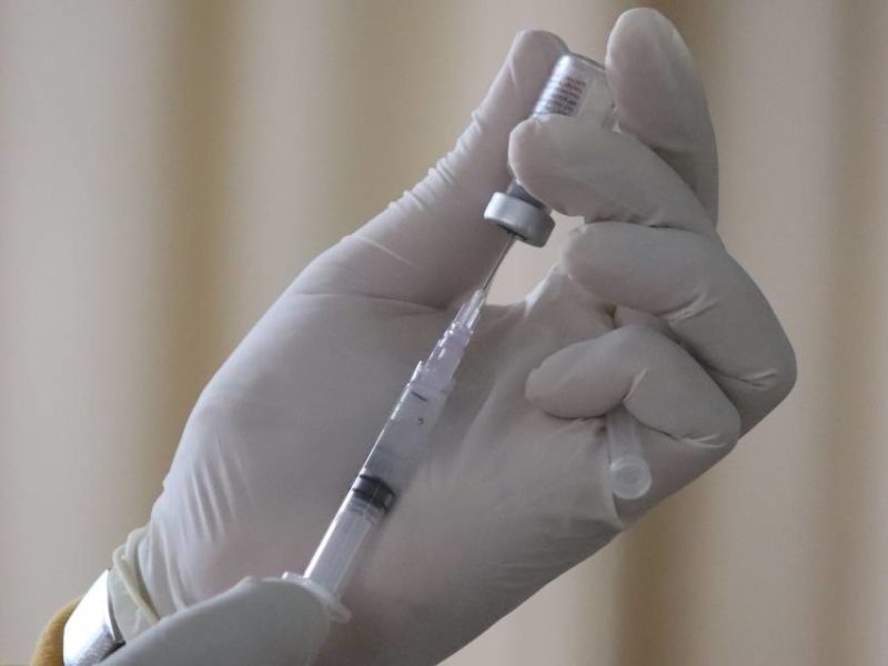 A vaccine being drawn into a needle.